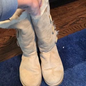 beige uggs. tall with 3 buttons